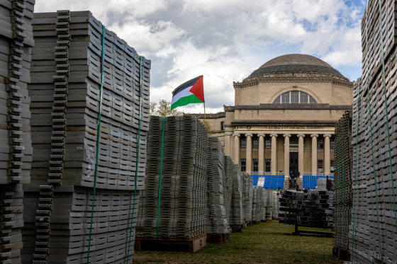 A Palestinian flag flies over supplies set up for Columbia's upcoming commencement ceremony.