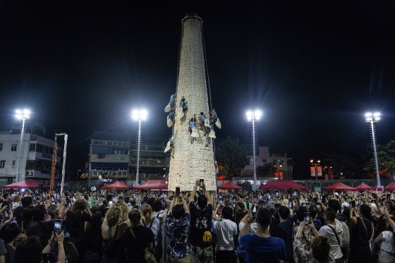 In Hong Kong, a midnight race up a bamboo tower of buns