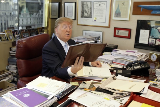 Donald Trump works at his desk in his New York office, Monday, Nov. 22, 2010