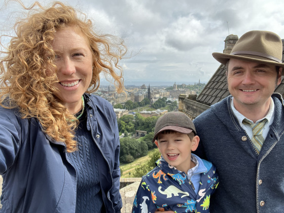 Kinsey Gidick taking a selfie with her son and husband