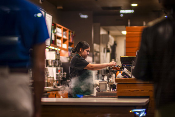 A barista at a coffee shop.
