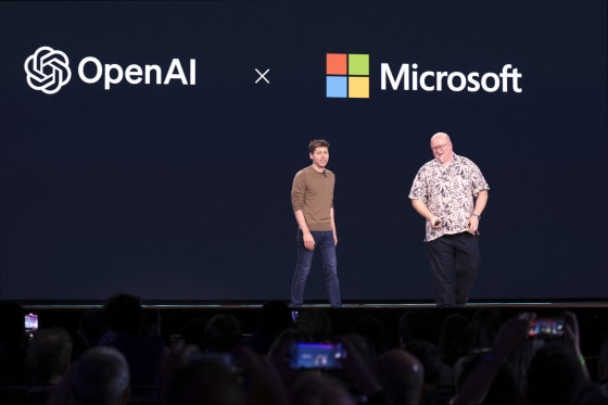 Sam Altman, left, and Kevin Scott speak during the Microsoft Build conference at the Seattle Convention Center Summit Building in Seattle