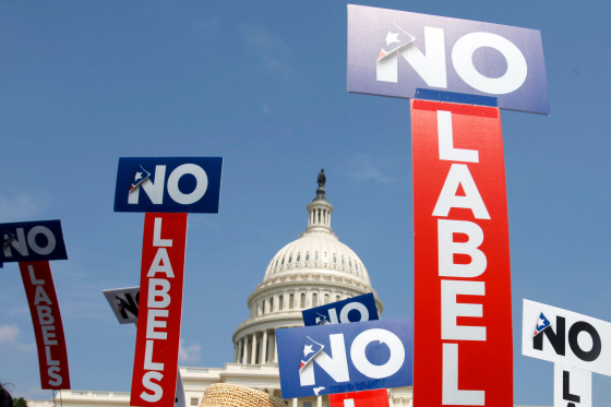 People with the group No Labels hold signs during a rally