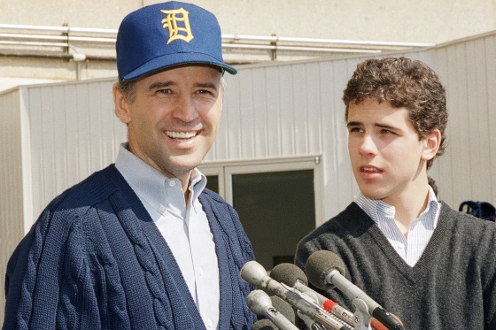 Sen. Joseph Biden, D-Del., wearing a University of Delaware baseball cap, leaves Walter Reed Army Hospital accompanied by his son Hunter Biden.