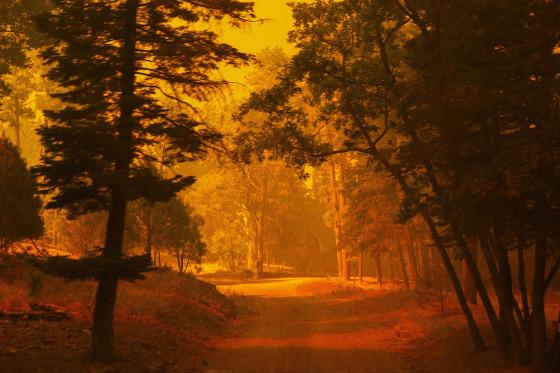 Smoke from the South Fork Fire casts an orange light in Ruidoso, New Mexico, on June 17, 2024.