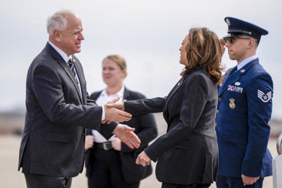 Tim Walz greets Kamala Harris.