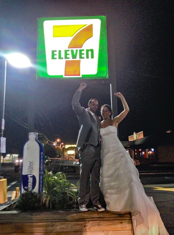 The couple poses for a photo at a 7-Eleven convenience store after their wedding on July 11, 2014.