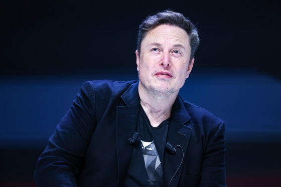 Elon Musk looks up