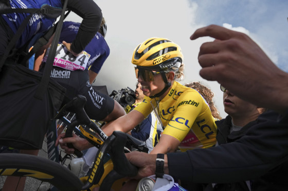 Overall winner Katarzyna Niewiadoma of Poland crosses the finish line to retain her yellow jersey in the eighth stage of the Tour de France on Sunday. 