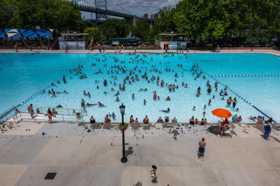 People swim at the Astoria Pool on the opening day