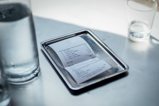 Bill in plate on restaurant table