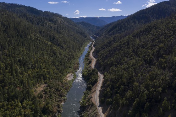 The Klamath River winds runs along state Highway 96 near Happy Camp, Calif. All the dams are scheduled to come down by the end of the year.