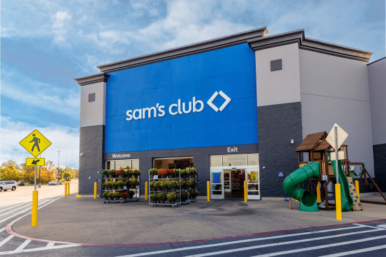 The outside of a Sam's Club storefront with blue and white signs