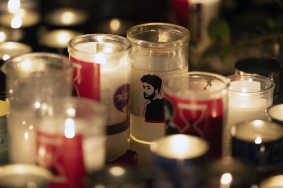 A candle with an image depicting the slain hostage Hersh Goldberg-Polin on a table during a vigil in his memory in Jerusalem on Sunday.