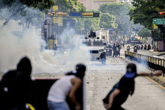 Protesters clash with police.