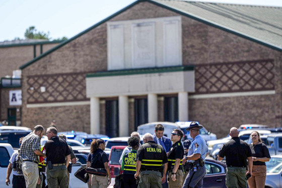 Police gather outside Apalachee High School.