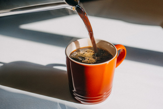 Coffee pouring in mug. 