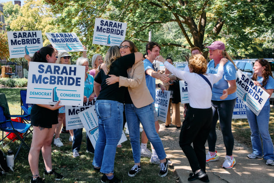 Sarah McBride hugs a supporter.