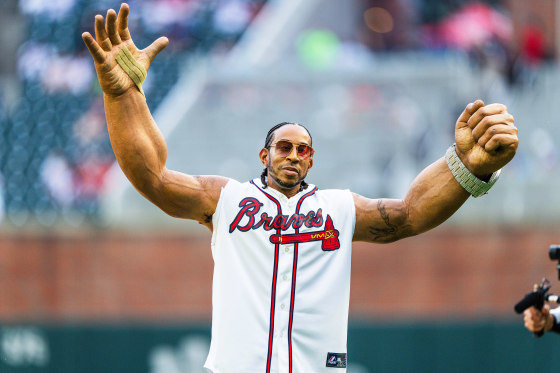 Ludacris reacts after throwing out the first pitch before the Atlanta Braves game.