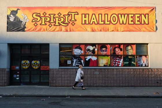A person walks past A Spirit Halloween location