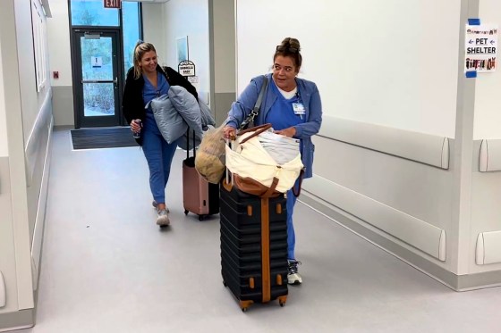 nurses in hospital luggage suitcases