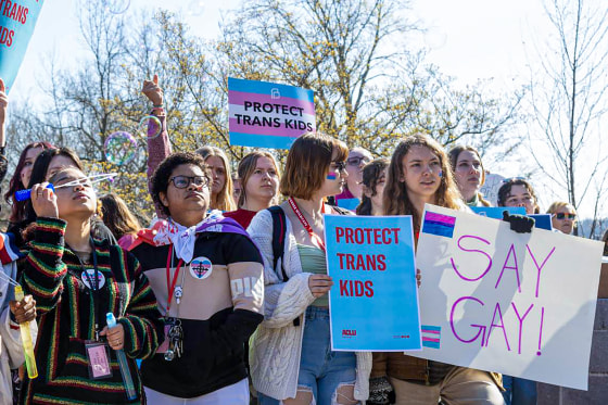 Teens with banners.