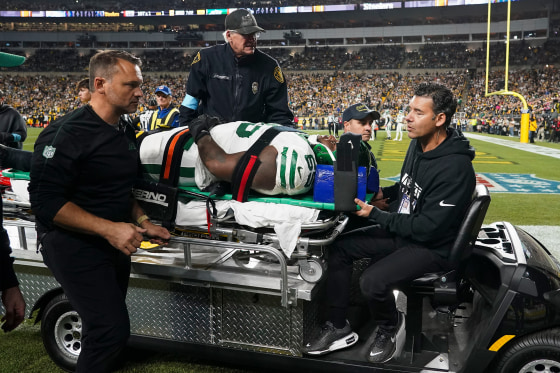 New York Jets guard Xavier Newman is carted off the field after being injured in the second half of an NFL football game against the Pittsburgh Steelers in Pittsburgh on Sunday. 2024. 