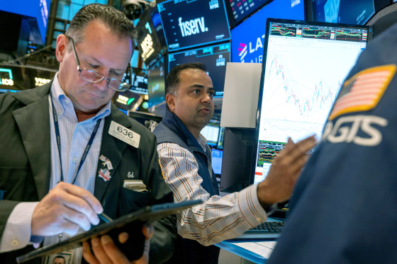 Image: NYSE Opens Tuesday Morning After Dow Loses Over 300 To Start Week traders nyse stock exchange