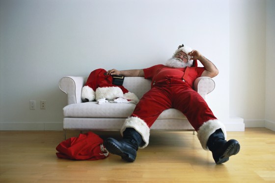 Exhausted Santa Claus on Couch