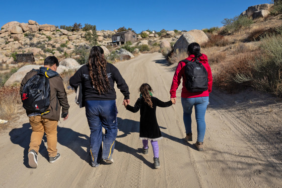 Colombian asylum-seekers walk through the desert after crossing the U.S.-Mexico border on Sept. 22, 2024 near Jacumba Hot Springs, Calif.