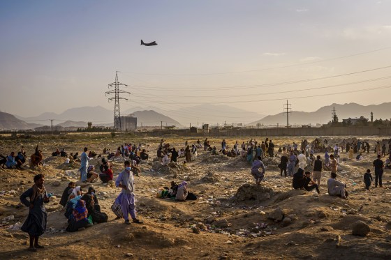 General view of people in a field.