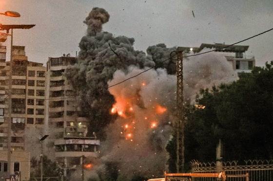 A fireball erupts at the site of an Israeli airstrike in Beirut