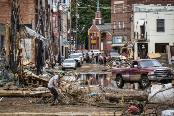 Workers, community members, and business owners clean up debris in the aftermath of Hurricane Helene.