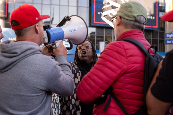 A man argues with Trump supporters outside a rally at New York's Madison Square Garden on Oct. 27, 2024. 