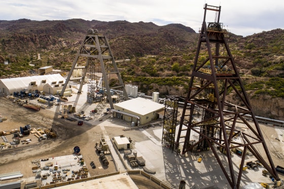 Copper extraction structures are seen outside amongst buildings and tools