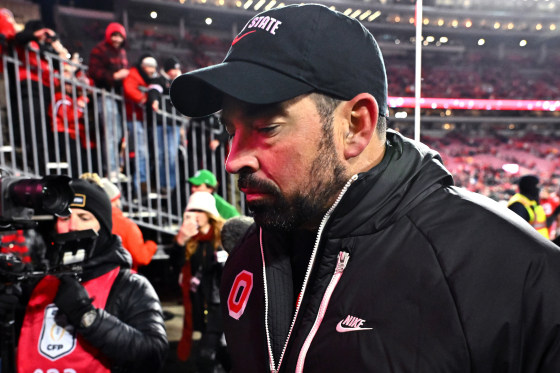 Ryan Day of the Ohio State Buckeyes walks off the field 