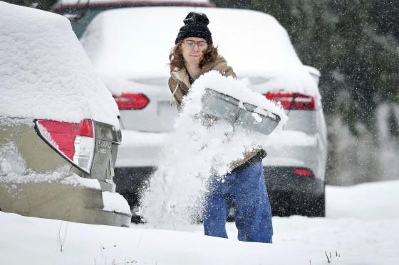 A man shovels snow from his driveway in Pennsylvania