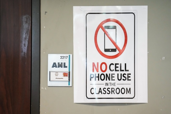 A No Cell Phone Use In The Classroom sign on a wall