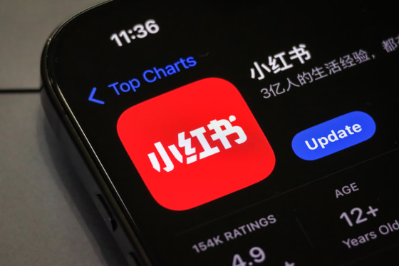 A smartphone screen shows the update page for the RedNote app on the app store