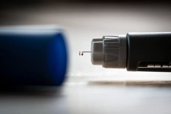 An Ozempic (semaglutide) injection pen is seen on a kitchen table