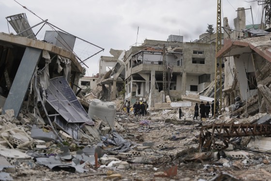 People view the destruction Sunday in Aita al-Shaab, a border village in south Lebanon, caused by the Israeli air and ground offensive.