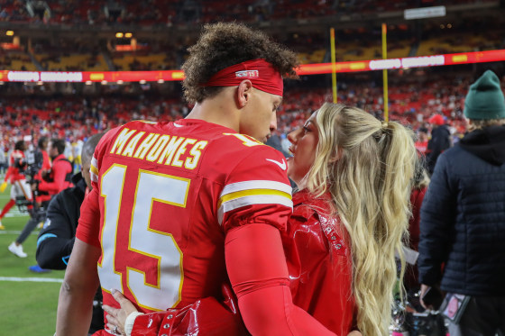 Kansas City Chiefs quarterback Patrick Mahomes and wife Brittany Mahomes hug before an NFL game between the Los Angeles Chargers and Kansas City Chiefs on Dec. 8, 2024 at GEHA Field at Arrowhead Stadium in Kansas City, Mo.