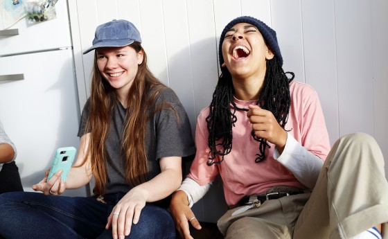 Girl friends hanging out together and laughing.