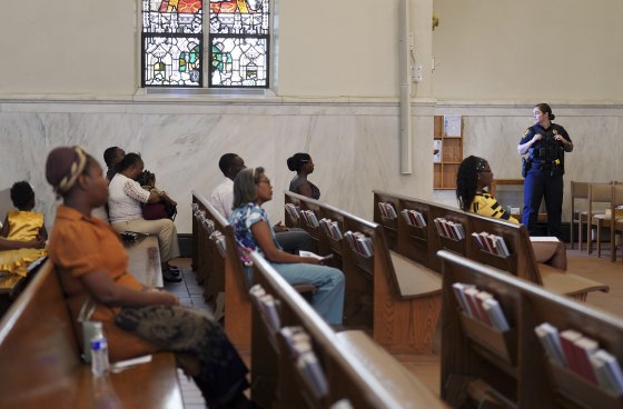 A police officer stands watch during a service in support of the Haitian community at St. Raphael Catholic church in Springfield, Ohio in Sept. 2024.