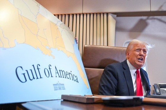 President Donald Trump next to a map showing the Gulf of America         