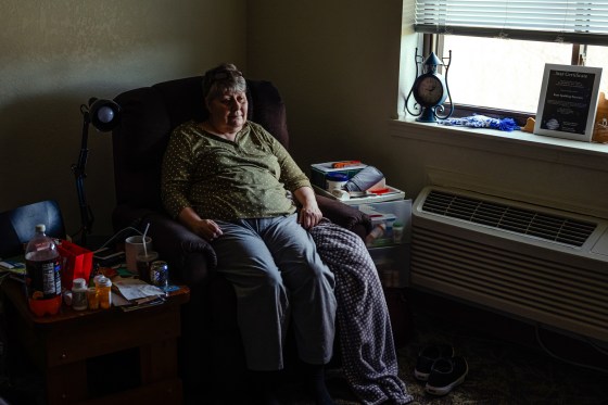 Kaye Peterson sits in her room at Village of Lebanon assisted living facility