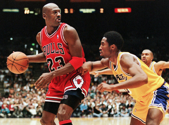 Michael Jordan of the Chicago Bulls is guarded by Kobe Bryant