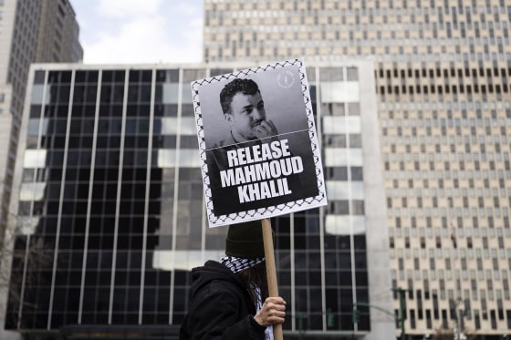 Demonstrator holds placard of Mahmoud Khalil 