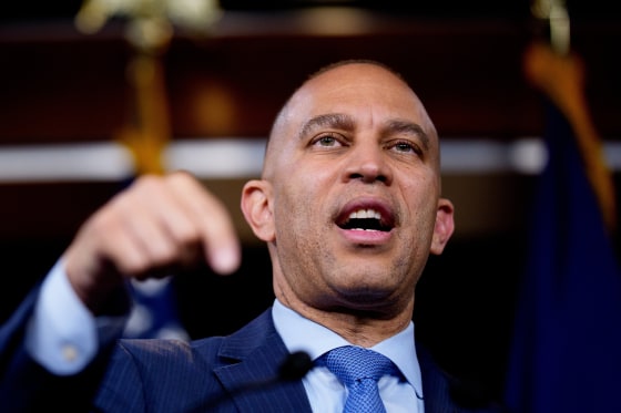 Hakeem Jeffries at a news conference gestures while speaking at a news conference
