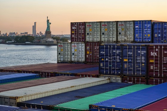 A container ship makes its way through New York Harbor
